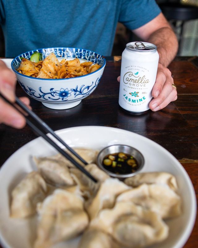 So you may already be a huge fan of @bing.mi, but have you been to their sister restaurant, Bing Mi Dumpling & Noodle Bar, also in NW Portland?! 🔥⠀
⠀
In keeping with the amazing flavors you know and love from Bing Mi, this spot shares more of the Chinese dishes Jacky grew up eating. 🥟⠀
⠀
We asked Jacky and the team to help us pick a few dishes to go with our Jasmine Kombucha, and it was a solid line up! 🙌⠀
⠀
We went with: House Pickles, San Xian Dumplings (shrimp, pork, & Chinese chives), and the Cong You Mian (Shanghai-style house-made scallion oil with thin noodles & sesame). It was all so fresh, savory, and comforting, and we loved how our Kombucha kept with the vibrant flavors! 😋⠀
⠀
Would you pick a dumpling 🥟 or noodle dish 🍜 to go with our Kombucha 💦?⠀
⠀
@bingmidumplingandnoodlebar⠀
⠀
• • • •⠀
⠀
#KombuchaForTeaLovers #CamelliaGrove #PDX #PortlandOR #PDXNow #PDXEats #PDXFoodie #YelpPortland #DishedPDX #BestFoodPortland #PDXLocal